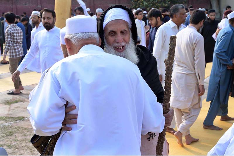 People exchanging Eid greetings with each other after offering Eidul-Fitr prayer at I-9 local park