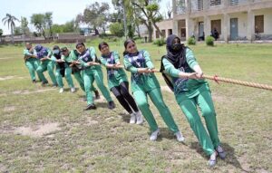Players participating in tug-of-war competition during Inter Girls Collegiate Tug-of-War Tournament organized by Education Board Sargodha.