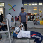 A female athlete participating in powerlifting competition organized by Punjab Raw Powerlifting Association with Collaboration of Pakistan Railway Sports Board.