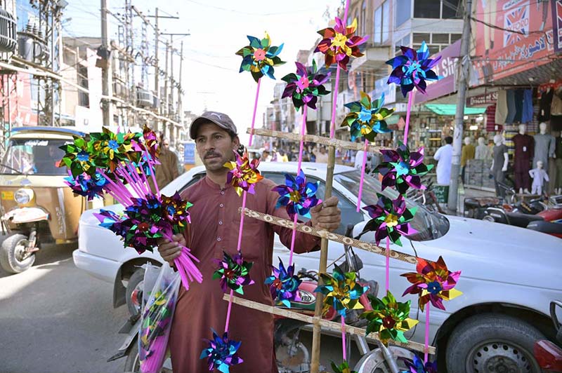 A vendor selling toys at Urdu bazar.