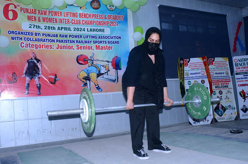 A female athlete participating in powerlifting competition organized by Punjab Raw Powerlifting Association with Collaboration of Pakistan Railway Sports Board.