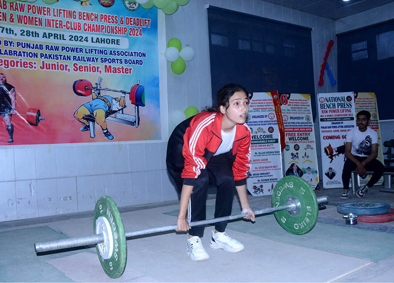 A female athlete participating in powerlifting competition organized by Punjab Raw Powerlifting Association with Collaboration of Pakistan Railway Sports Board.