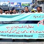 CEO Mohammad Idris is distributing Leading the rally Awareness campaign for health and cleanliness at Walton Road