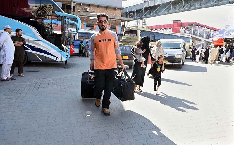 People arrives at Faizabad Bus Stand to travel their hometowns to celebrate Eid ul Fitr with their loved ones