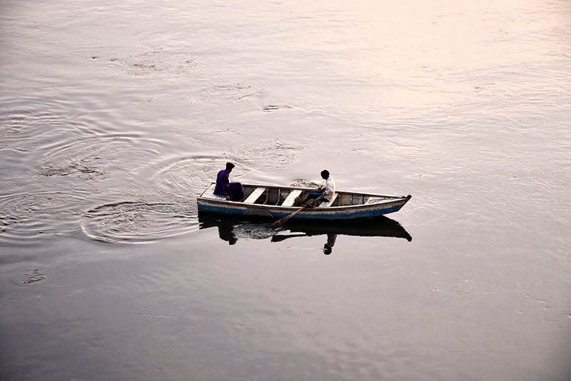 Youngsters enjoying boat ride in River Ravi during evening time in Provincial Capital