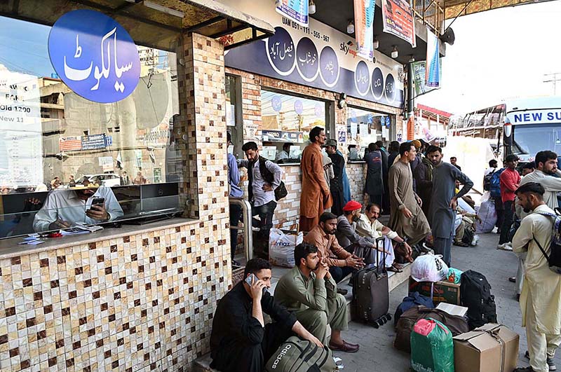 People arrives at Faizabad Bus Stand to travel their hometowns to celebrate Eid ul Fitr with their loved ones
