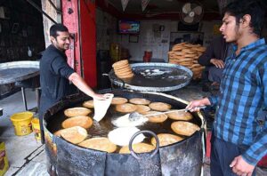 Vendors frying Pheni at Bani Bazaar to be used in upcoming Eidul Fitr festive.