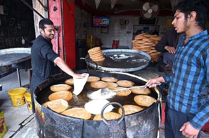 Vendors frying Pheni at Bani Bazaar to be used in upcoming Eidul Fitr festive.