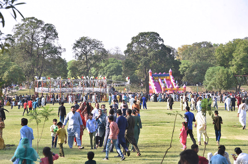 Children enjoy swings in Gulshan-e-Iqbal Park on the 2nd day of Eid-ul-Fitr celebrations