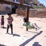 Children enjoy swings at old Civil Line