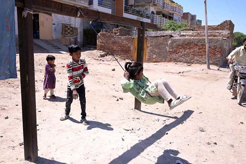 Children enjoy swings at old Civil Line