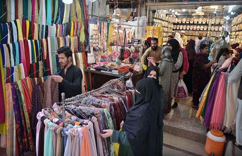People busy in doing Eid shopping at Commercial market ahead of Eidul –Fitr.