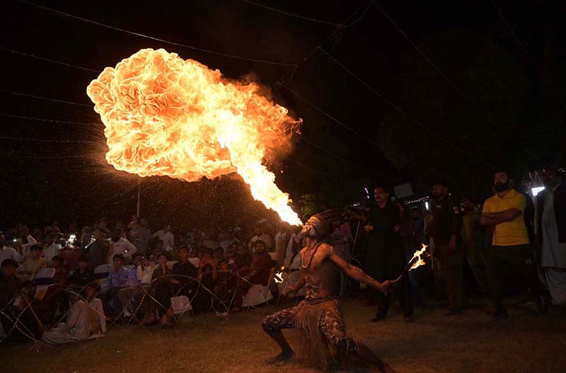 A gambler showing his skill during Flora Festival at Club Road.