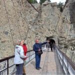 Foreign tourist visiting the historical 100 years old suspension wooden bridge Daniyor