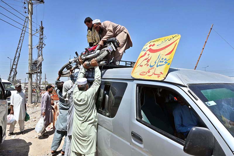 People arrives at Faizabad Bus Stand to travel their hometowns to celebrate Eid ul Fitr with their loved ones