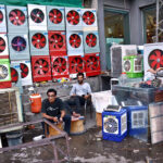 A worker is preparing room coolers at his workplace as per increasing demand in summer season