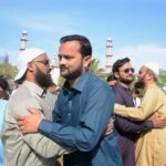 People exchanging Eid greetings after offering Eidul Fitr prayer at Aram Bagh Masjid.