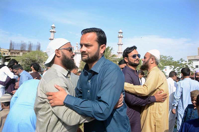 People exchanging Eid greetings after offering Eidul Fitr prayer at Aram Bagh Masjid.