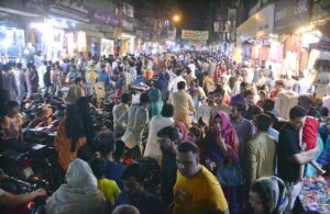 A shopkeeper is attracting customers in the upcoming Eid-ul-Fitr by showcasing women's favorite artificial jewelry products.