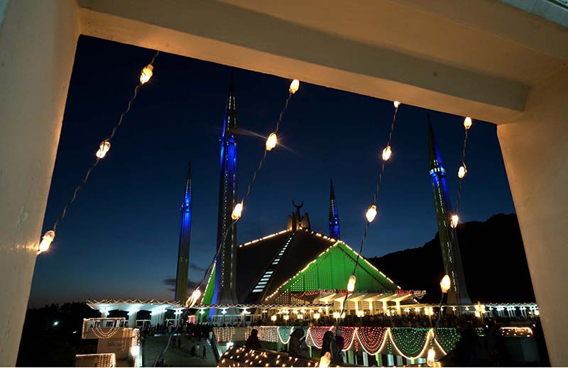 An illuminated view of Faisal Masjid decorated with colourful lights in connection with Shab-e-Qadar on 27th day of Holy fasting month of Ramzanul Mubarak