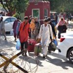 People along with their luggage arrives at Railway Station to leave for their hometowns to celebrate Eid-ul-Fitr with their loved ones