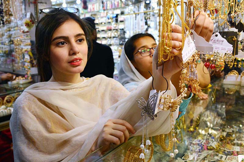 People busy in Eidul Fitr shopping at a market in the city