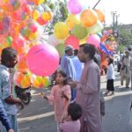 People purchasing balloons for children on the occasion of Eidul Fitr