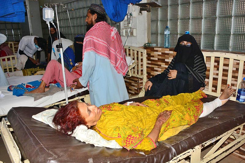 Injured passengers being treated in Civil Hospital who sustain injuries in road accident between passengers coach and oil tanker, resulting 07 passengers died and 15 injured in incident at Manjhand City, Sehwan Road.