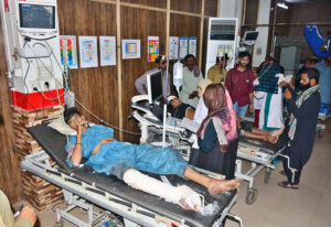 Injured passengers being treated in Civil Hospital who sustain injuries in road accident between passengers coach and oil tanker, resulting 07 passengers died and 15 injured in incident at Manjhand City, Sehwan Road.