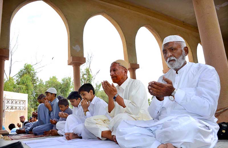 Children purchasing balloons from a vendor outside Eidgah on the occasion of Eidul Fitr