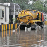 WASA heavy machinery being used for the drainage of rainwater in front of the main gate of the Police Line after rain in the city