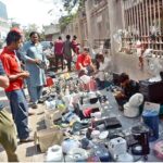 A vendor displaying different daily use items to attract customers at roadside setup