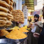Vendor selling and displaying traditional food items to attract the customers here in the Hashtnagri area
