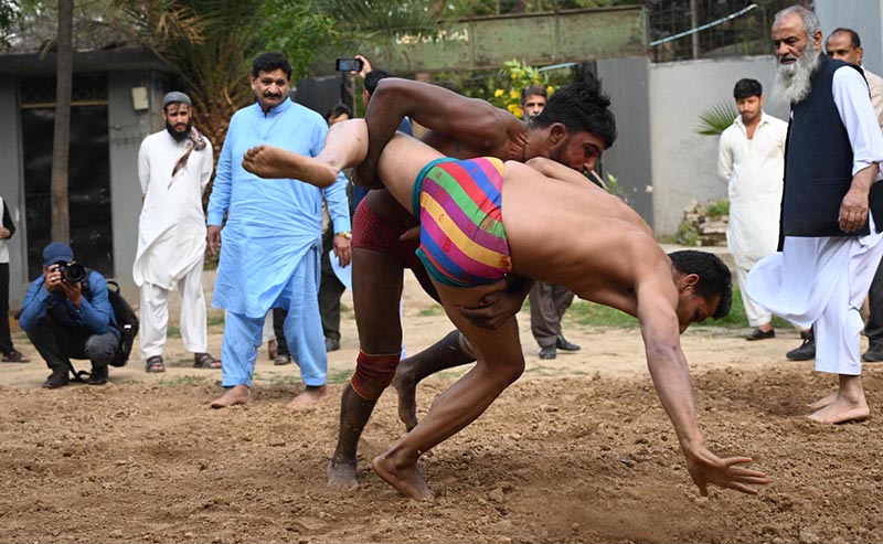 Pakistani wrestlers showcase their skills at the century-old Akhara during the annual spring wrestling competition at Liaqat Bagh