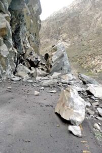 A view of Skardu-Gilgit Road blocked due to heavy rain and land sliding.