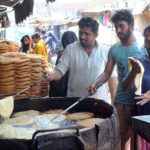 Vendors are busy frying Pheoni at their workplace to be used in the upcoming Eid Ul Fitr festival