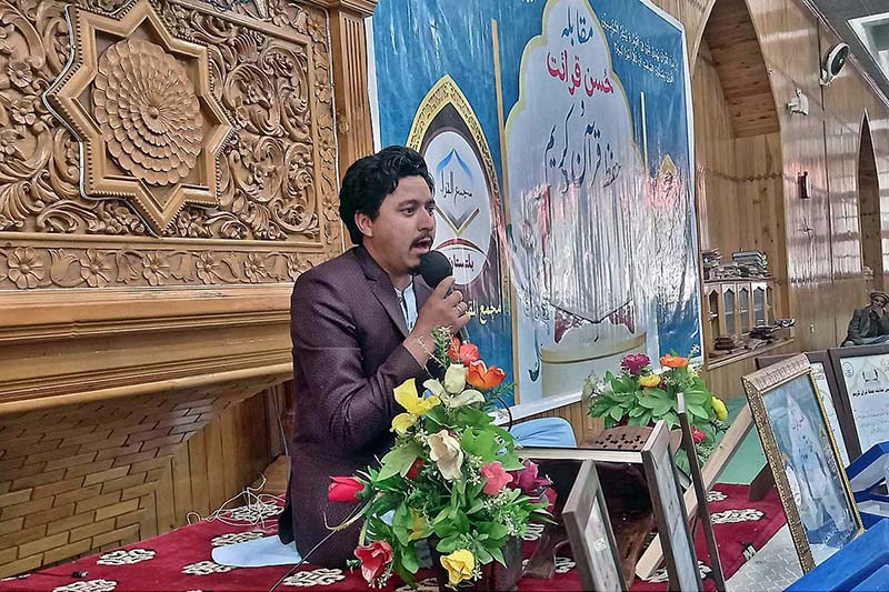 A participant reciting Holy Quran during the Husn-e-Qiraat and Hafiz Quran competition at Jamia Masjid Skardu-Baltistan in the Holy Month of Ramazan