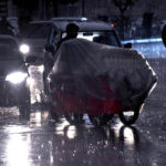 Vehicles on the way during rain that experienced in the Provincial Capital