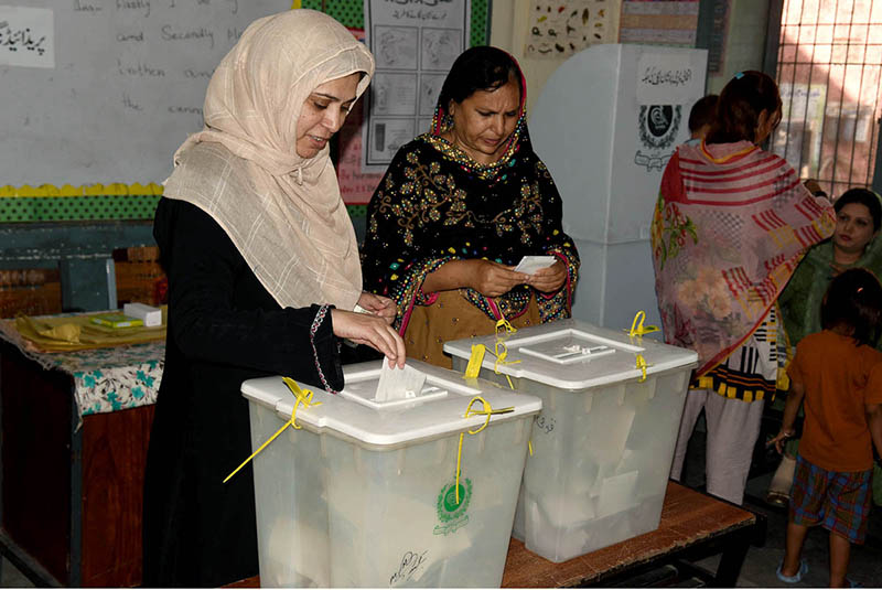 Female voters casting their votes in a polling station during the by-election 2024 at Garhi Shahu School