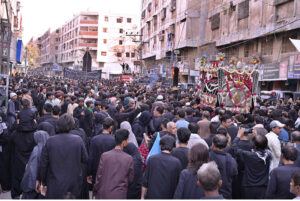 Shia Muslim attending mourning procession on Yom-e-Shahadat at Dadan Shah Road.