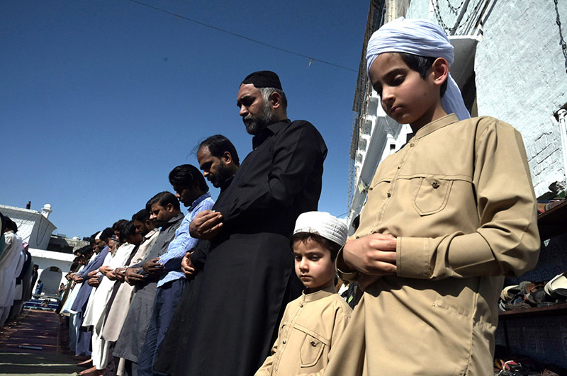 A Large number of people offering Jumma-Tul-Wida prayer during the Holy month of Ramazan Ul Mubarak at Jamia Masjid Zia ul Aloom Satellite Town