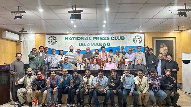 A group photograph of newly elected office bearers of Rawalpindi Islamabad Photo Journalist Association 2024-25 at National Press Club.
