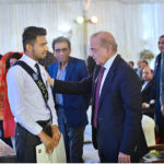 Prime Minister Muhammad Shehbaz Sharif meets a student of Danish School, Jand, Attock in the ceremony at the proposed site of Danish School