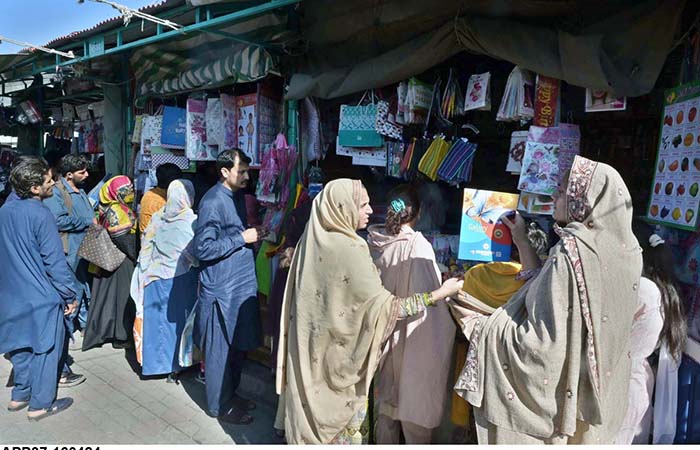 Families purchasing school uniform for their children as new session starts in schools at H-9 Weekly Bazaar in Federal Capital.