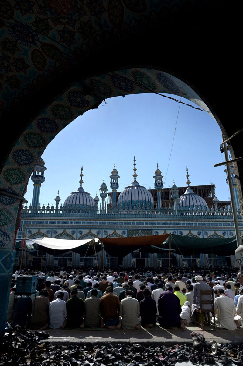 A Large number of people offering Jumma-Tul-Wida prayer during the Holy month of Ramazan Ul Mubarak at Jamia Masjid Zia ul Aloom Satellite Town