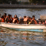 Visitors enjoy boat ride in Greater Iqbal Park at evening time