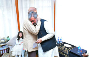 Prime Minister Muhammad Shehbaz Sharif handing over PM's Shuhada Assistance cheque to the father of Custom's Inspector Hussnain Ali Tirmazi Shaheed.