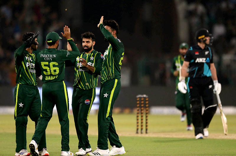 Pakistani players celebrated the wicket of New Zealand batsman Michael Bracewell catch Babar Azam ball by Shadab Khan during the Fifth Twenty20 International cricket match between Pakistan and New Zealand at the Qaddafi cricket stadium