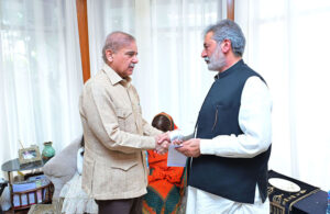 Prime Minister Muhammad Shehbaz Sharif handing over PM's Shuhada Assistance cheque to the father of Custom's Inspector Hussnain Ali Tirmazi Shaheed.