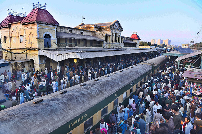 Children waving hands after getting board on Eid Special Train at Cantt Railway Station, departing to their home towns for celebrating Eidul Fitr, festive